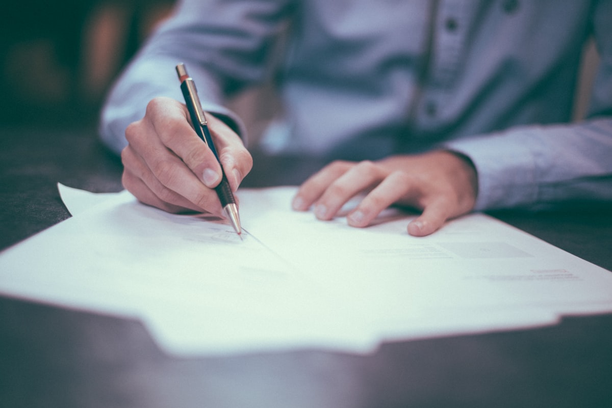 Self employed person reviewing health insurance plan options at desk