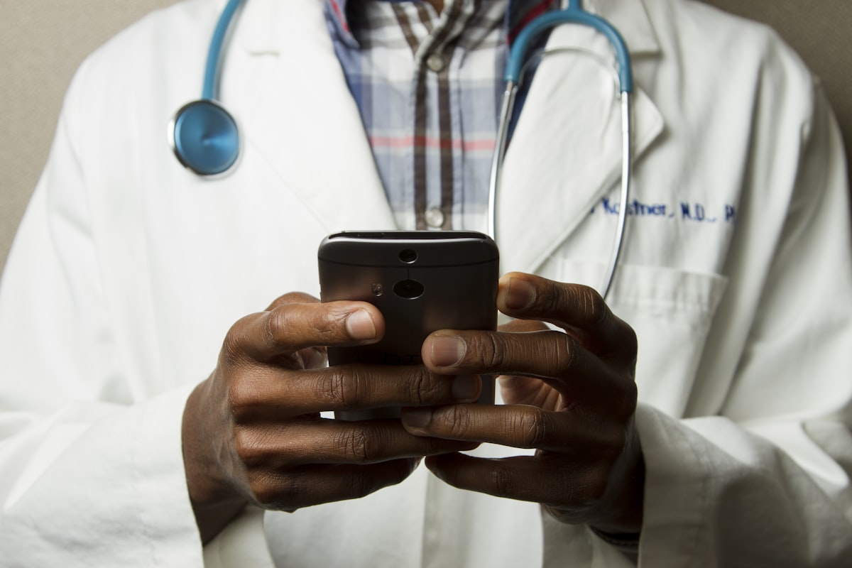 Doctor reviewing patient chart with stethoscope
